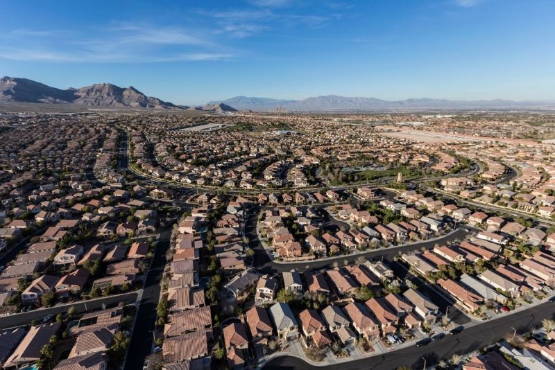 Aerial photo of suburban Las Vegas neighborhoods stretching toward the mountains.