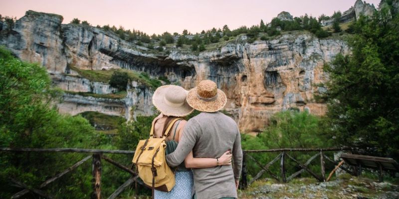 Couple enjoying a scenic destination on a well-planned vegan trip