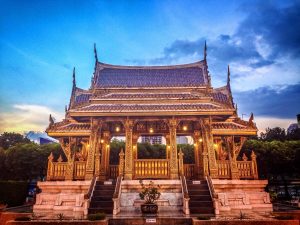 A wat in Thailand against the sunset