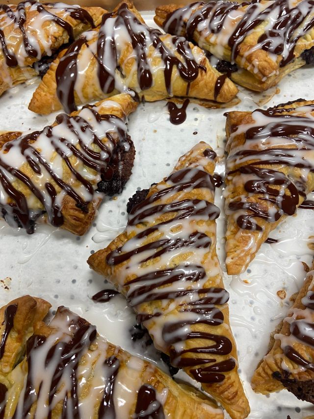 Warm donut holes -&nbsp; tossed in sugar with a creme anglaise, berry compote