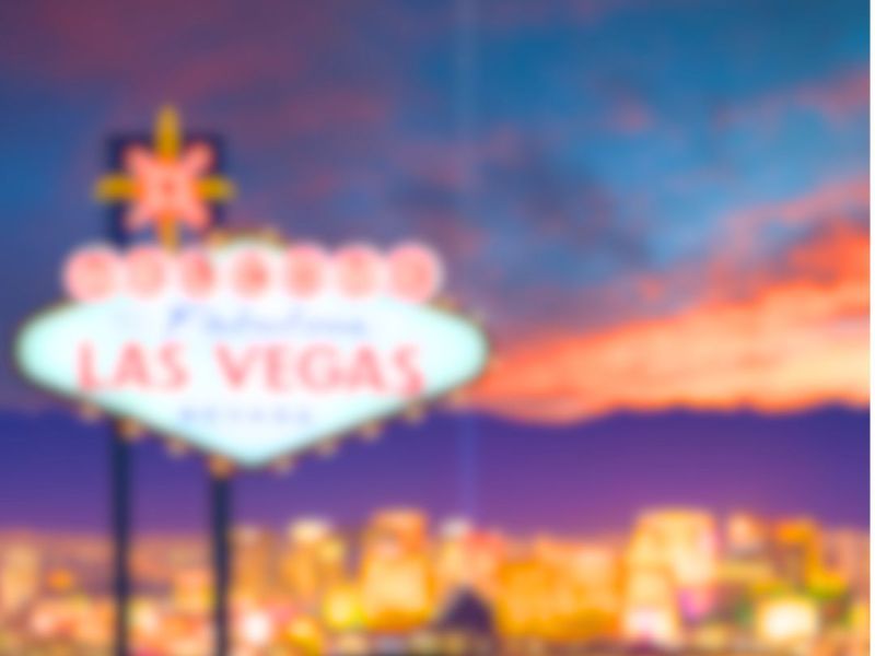Featured graphic for “The Ultimate Vegan Guide to Las Vegas” with a blurred Las Vegas Strip background and retro-inspired typography.